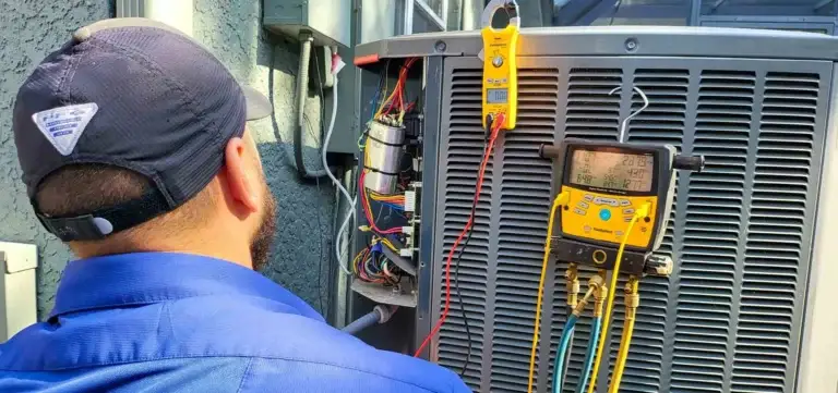 HVAC technician repairing an AC unit in Pinellas County